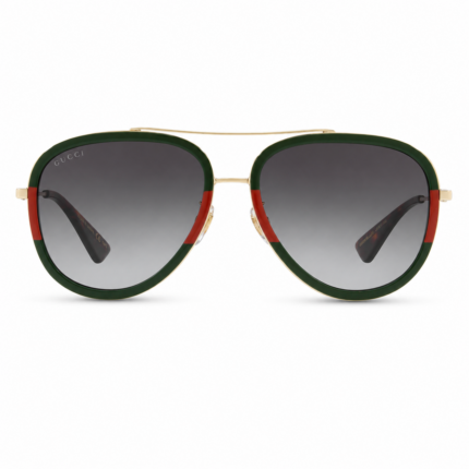 Lentes de sol Gucci estilo aviador con montura verde y rojo, estructura dorada y cristales degradados en vista frontal sobre fondo blanco.